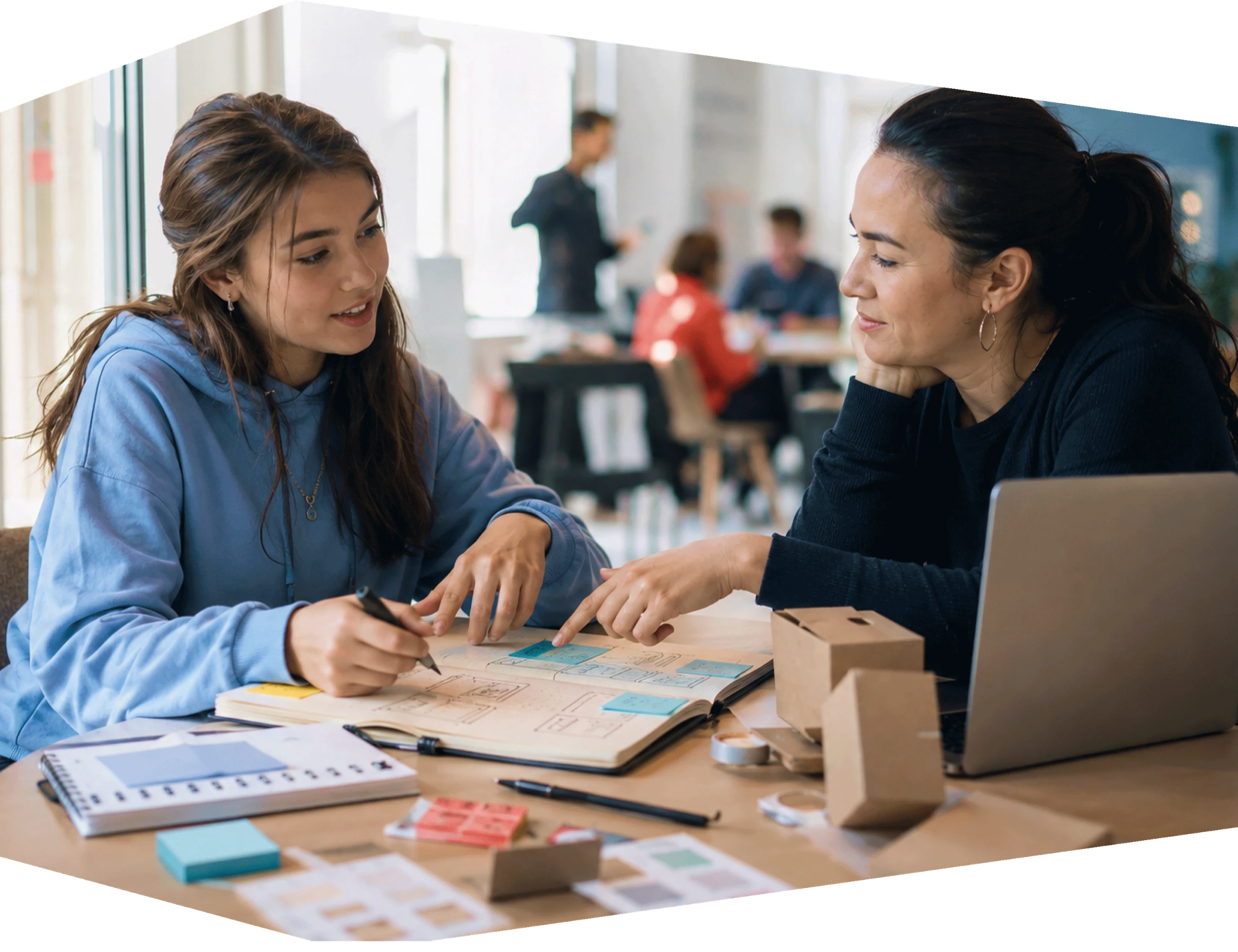 A student developing a business idea with a mentor